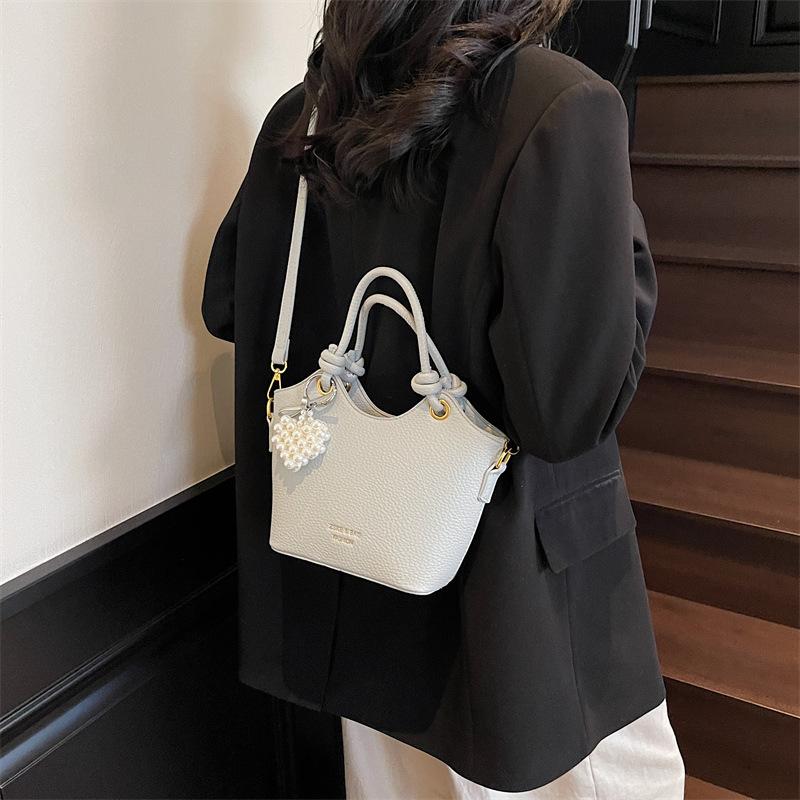 

Hand carry fashion bucket bag women s shoulder bag 2025 new simple casual portable messenger bag 23*9*17