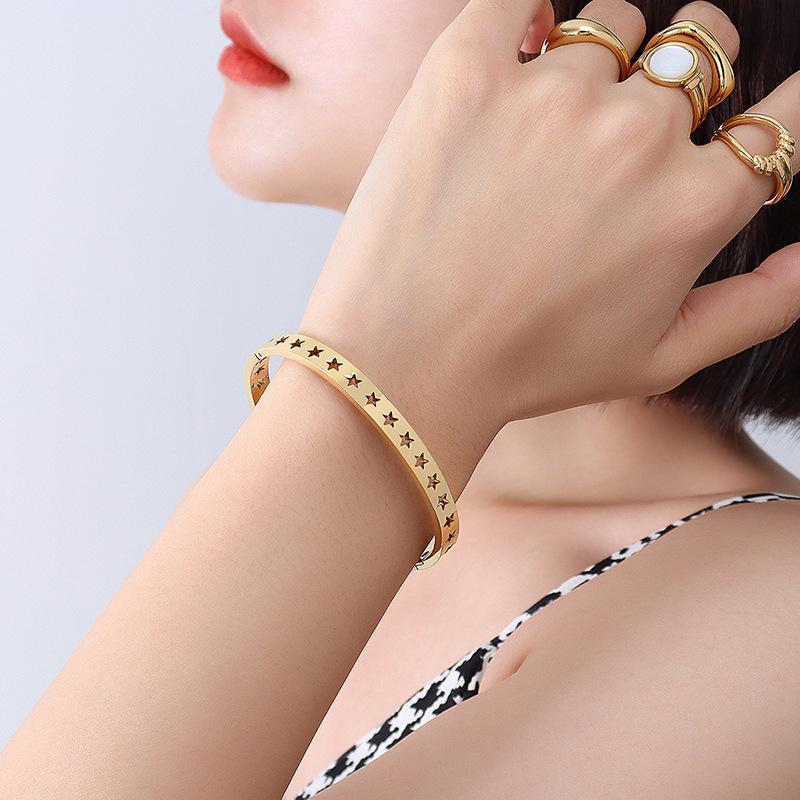 Korean Niche Five-Pointed Star Hollow Bracelet - Exquisite Gold-Tone Titanium Steel Jewelry for Women