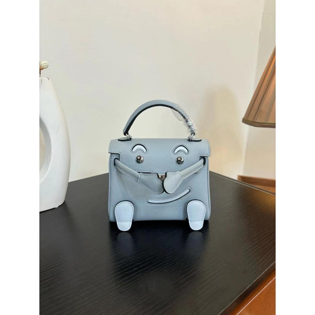 Borsa a faccina sorridente nuova per la primavera e l'estate 2025 borsa Kelli mini in pelle bovina di primo strato di alta gamma borsa a tracolla carina da millenial