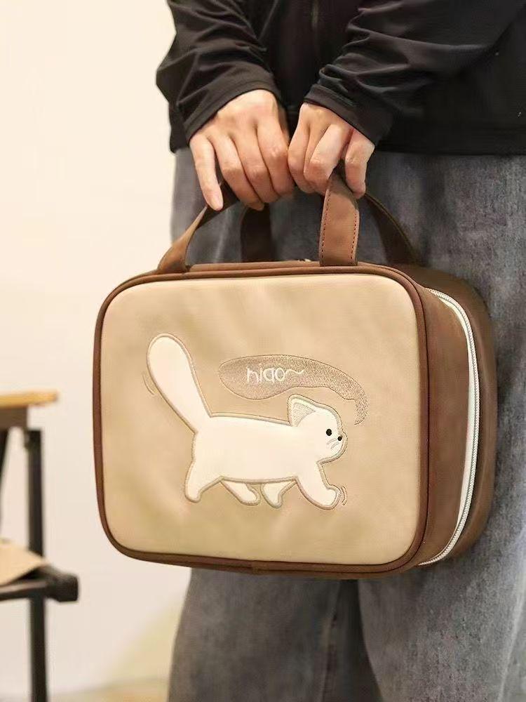 Spacious Cartoon Travel Makeup Bag: Portable, Multi-Compartment, and Three-in-One Design