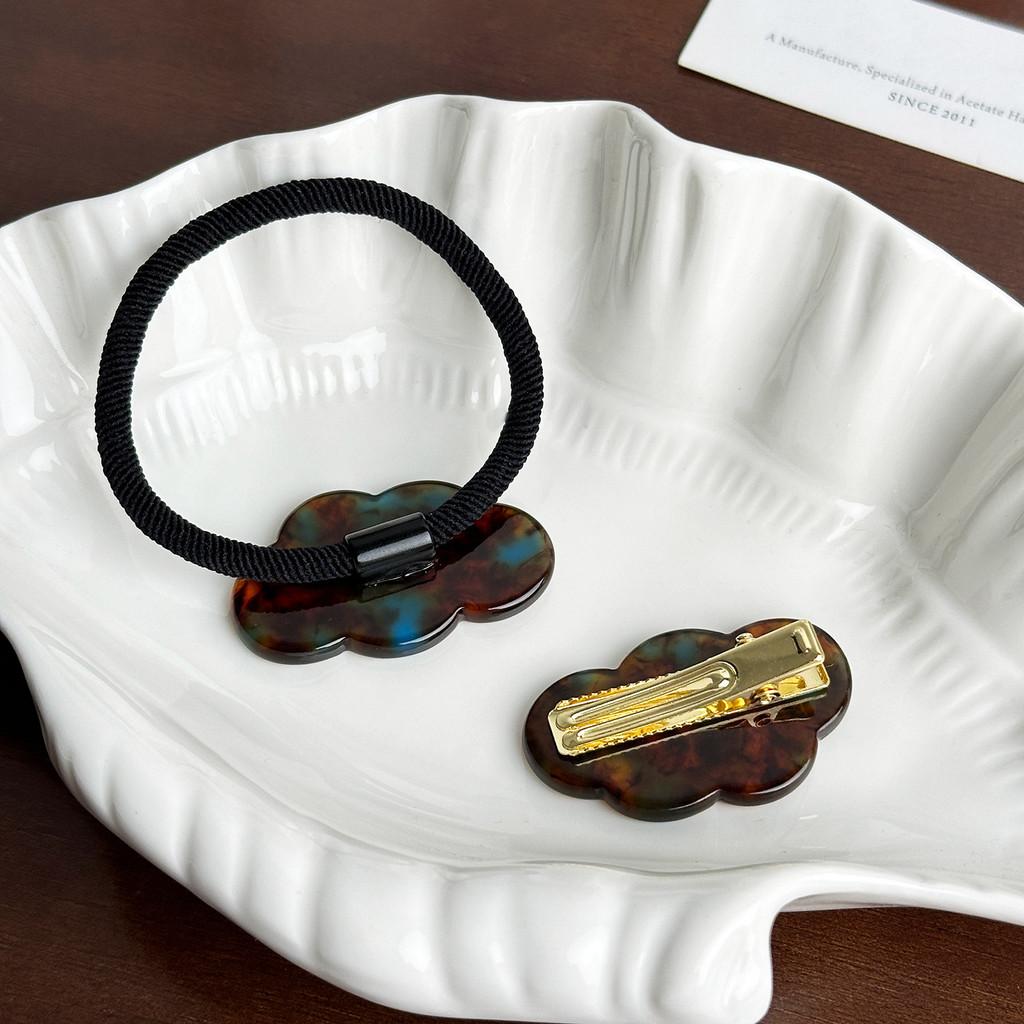 Fashionable And Stylish Acetate Cloud Hair Tie With Gold Accent And Elegant Hair Clip