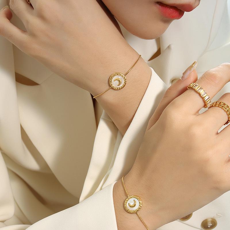 Women's Titanium Steel Jewelry Set: Crescent Moon Necklace, White Shell Earrings, and Non-Fading Bracelet.