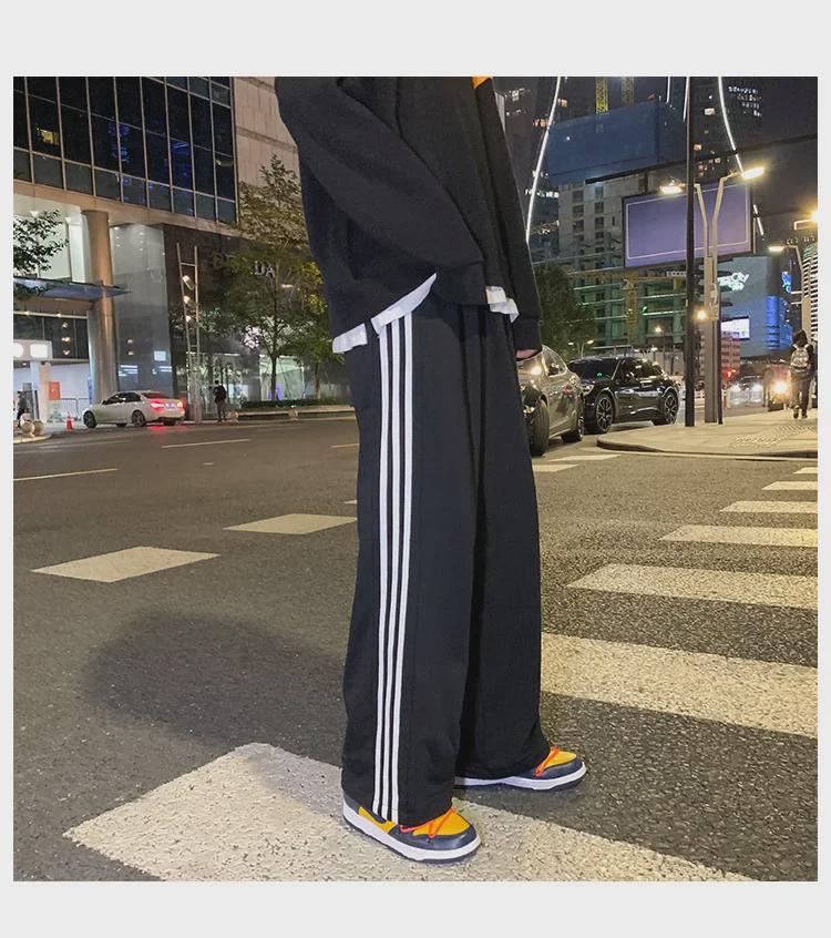 Damskie spodnie sportowe w paski w stylu koreańskim - luźne, sięgające do ziemi, w jednolitym kolorze, na wiosnę i jesień
