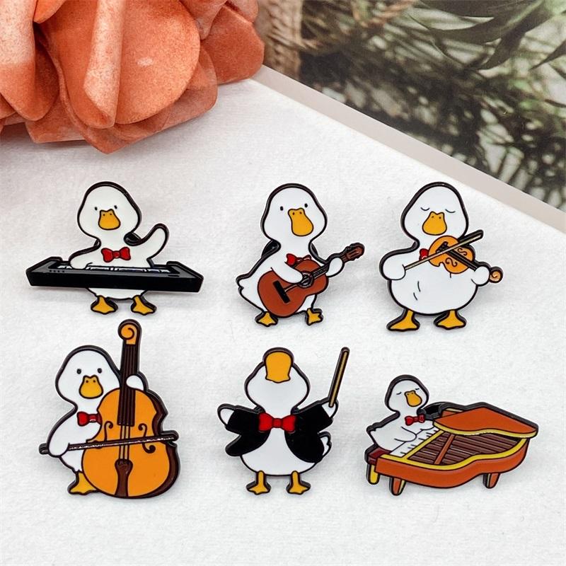 Cute Musician Duck Enamel Brooch Creative Cartoon Violin Piano Baton Guitar Animals Lapel Pins Backpack Jewelry Gifts For Kids