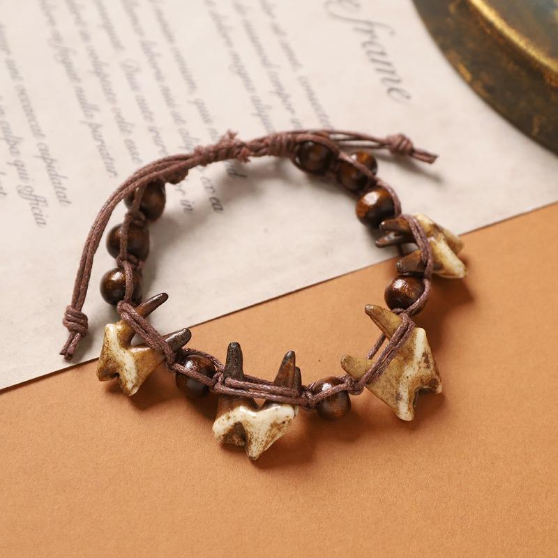 Retro Tibetan braided dog tooth bracelet handmade exotic personalized hand rope niche stacked wear men's and women's accessories