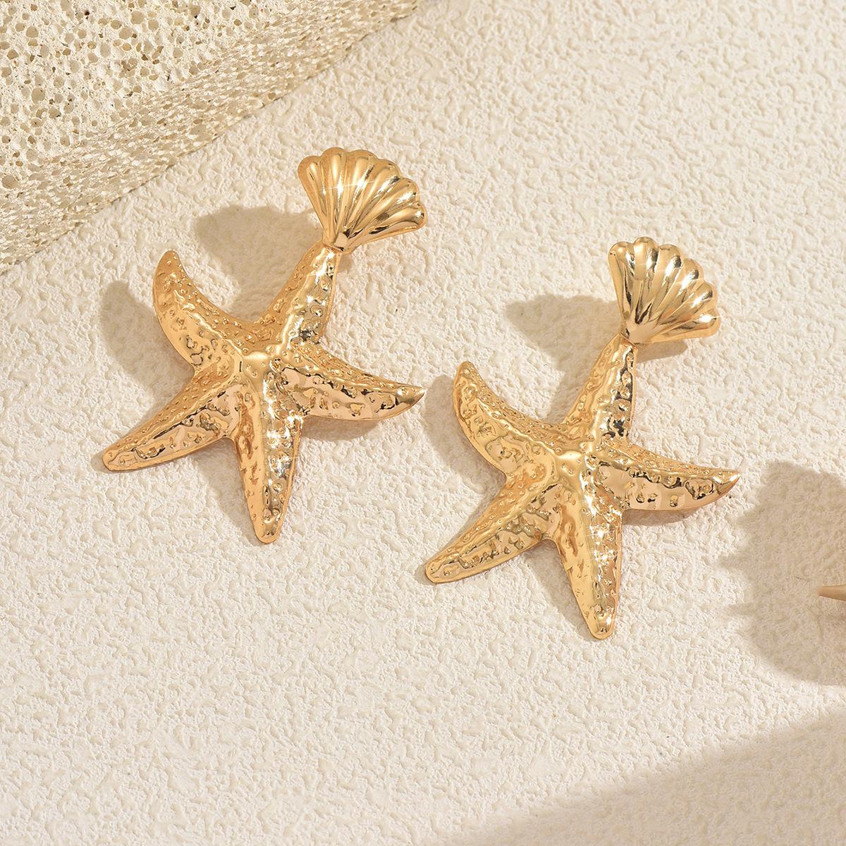 Gold earrings European and American irregular starfish earrings women s beach vacation pleated texture exaggerated stud earrings