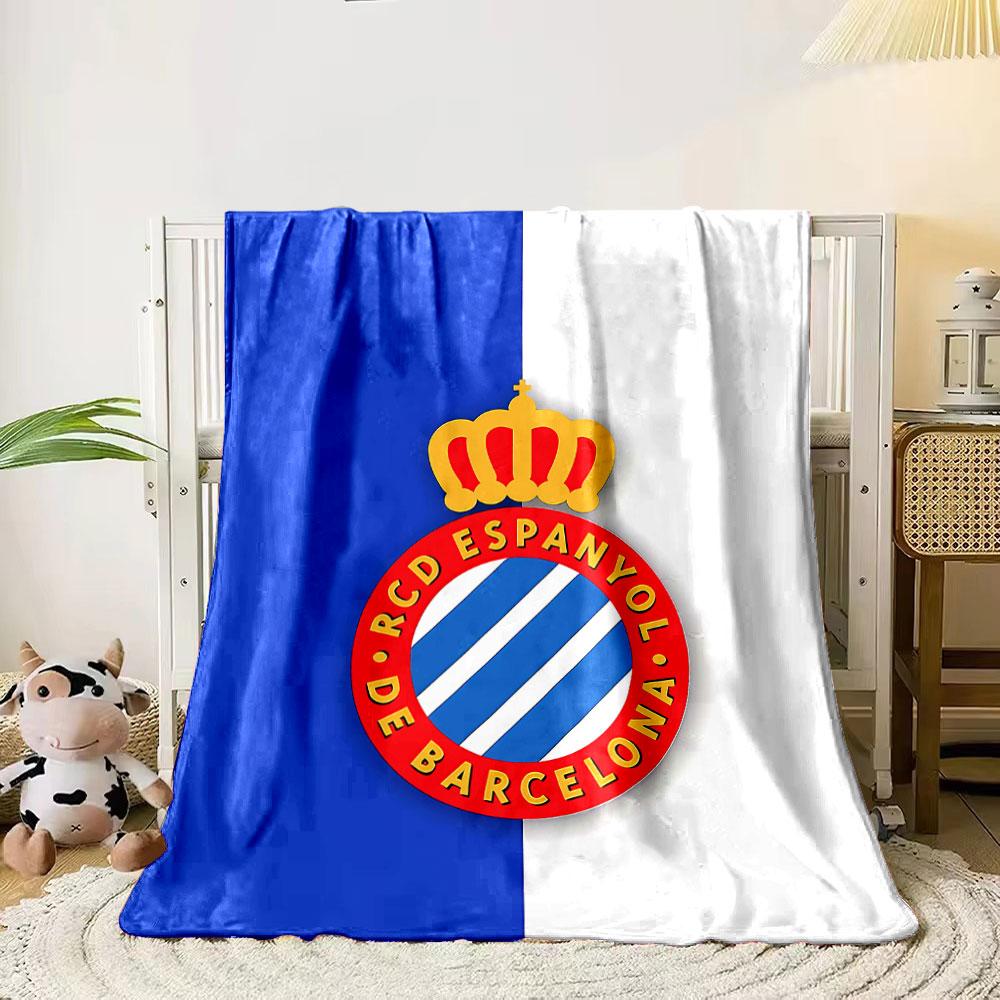 A blue and white striped crest with a red circular border and gold crown. for all seasons blanket lunch break throw gift