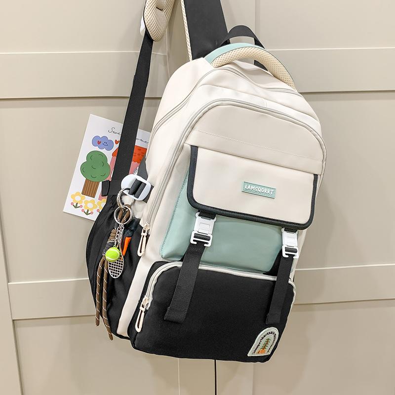 New large-capacity contrasting color schoolbag, waterproof protection for campus students, durable and lightweight backpack, trend research backpack.