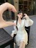 Gentle wind V-neck lace-up long-sleeved dress women's summer new French temperament thin fungus edge little white skirt