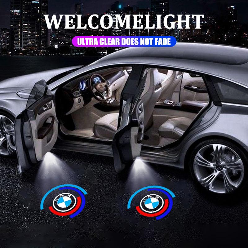 BBIU7 2Pcs Led HD Car Door Welcome Light Projector Lamps For BMW 50th Anniversary 1 3 5 7 series E83 F16 E70 Car Styling Accessories