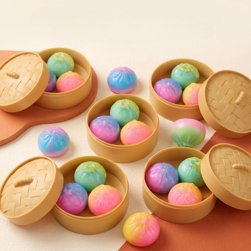 4-piece set: 1 steamer + 3 bun-shaped toys (colors shipped randomly). Fun and unique glitter squishy bun toys, comes with a storage steamer box.
