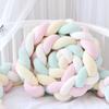 Three-strand knitted crib bumper, cable knit crib bumper