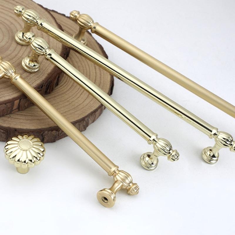 Skříňkové úchytky se zlatou povrchovou úpravou Ergonomický design Hardware odolný proti korozi Jednoduchá instalace Pro kuchyňské skříňky Komody