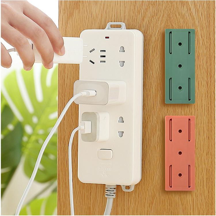 Power strip holder household socket plug-in board holder removable non-punching wall paste finishing device