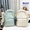 Schoolbag high value solid color backpack schoolbag Japanese campus simple versatile light flash class large capacity double backpack