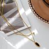French Retro Two-Layer Black Oval Necklace: Women's Titanium Steel Clavicle Chain, Fade-Resistant Design.