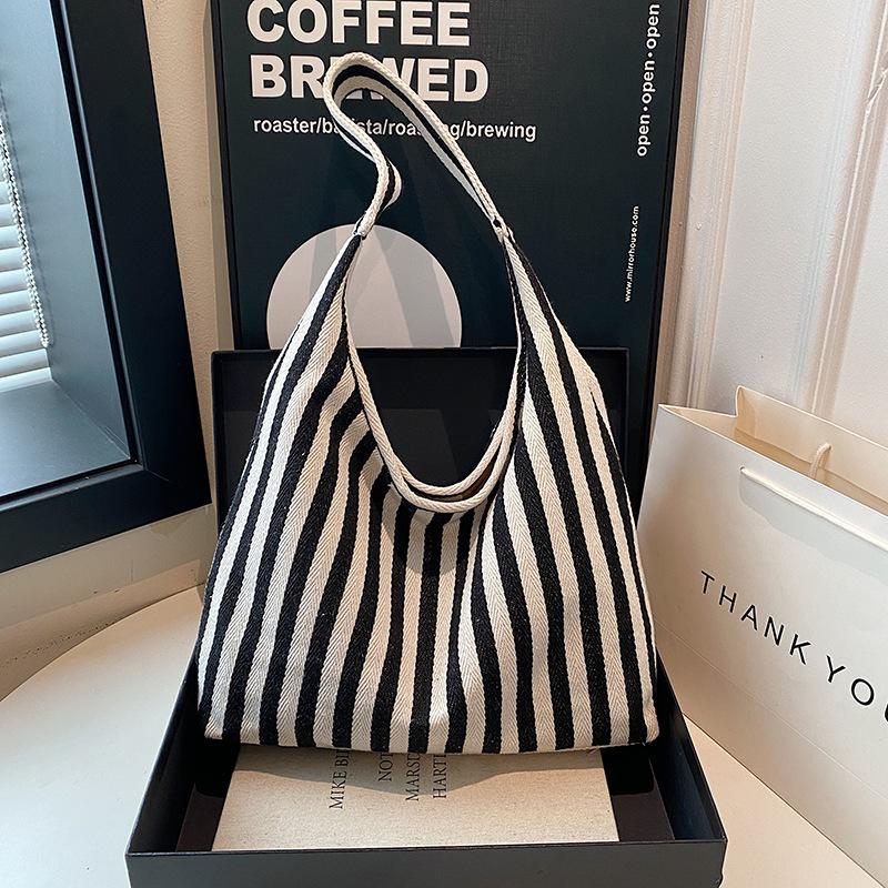 

Contrasting color literary handbag simple small fresh striped canvas bag casual fashion large capacity shoulder women s bag 35*26*11cm чёрный