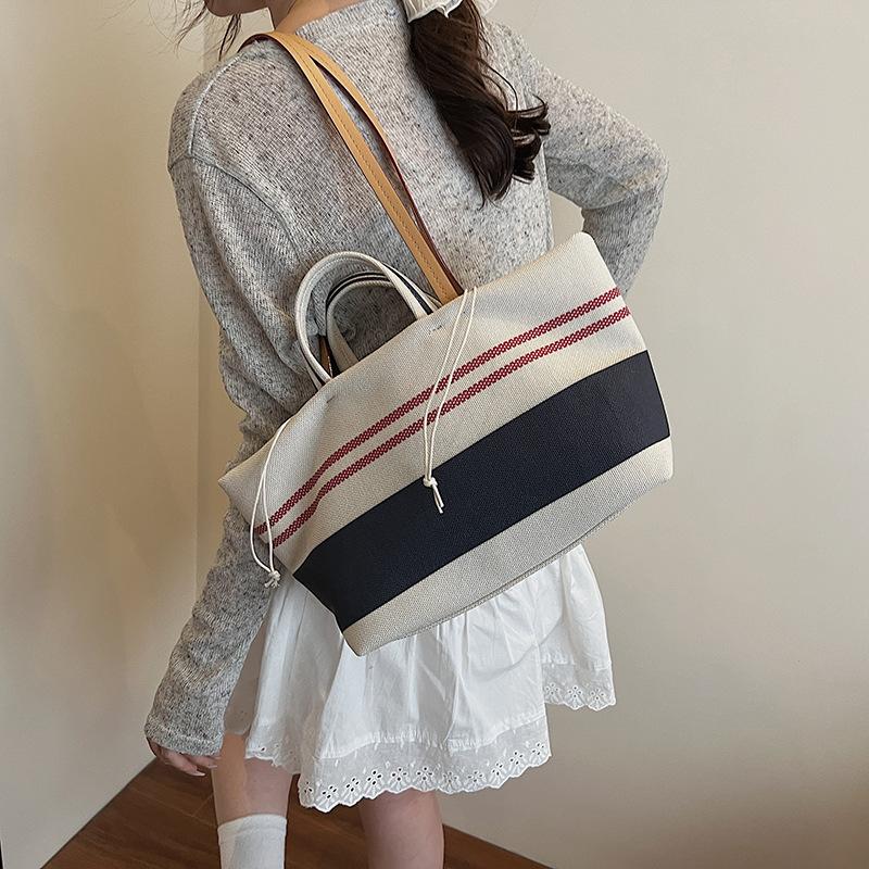 Niche high-end handbag women's 2025 new striped canvas bag large-capacity shoulder underarm commuter bag