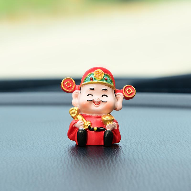 

Creative Swinging Car Console Aromatherapy Ornament: Shaking Head God of Wealth for Good Luck