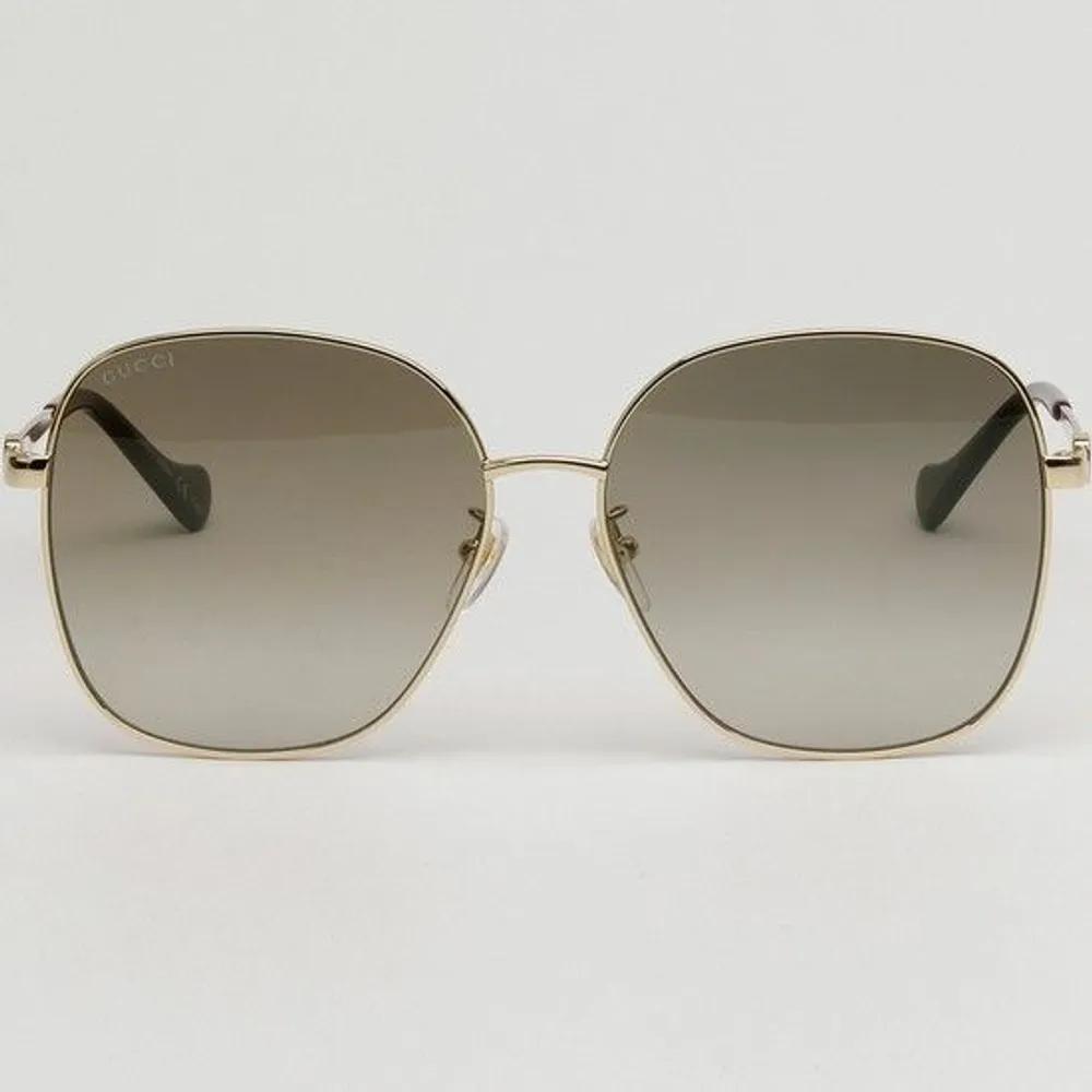 Sunglasses GG1089SA 002 Square Oversized Gold Rim Daily