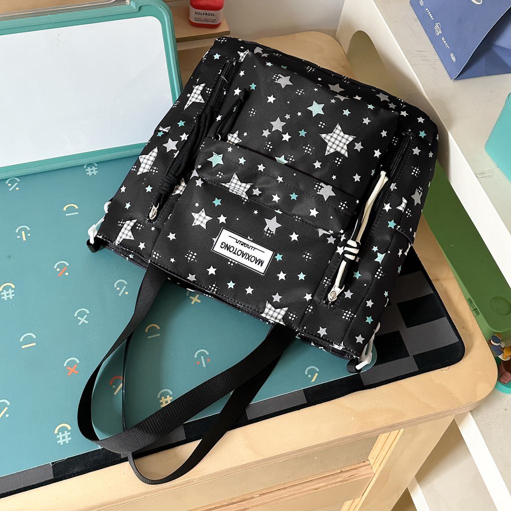 Schoolbag small fresh student schoolbag female ins cartoon star printing junior high school student large capacity backpack burden reduction spine bag