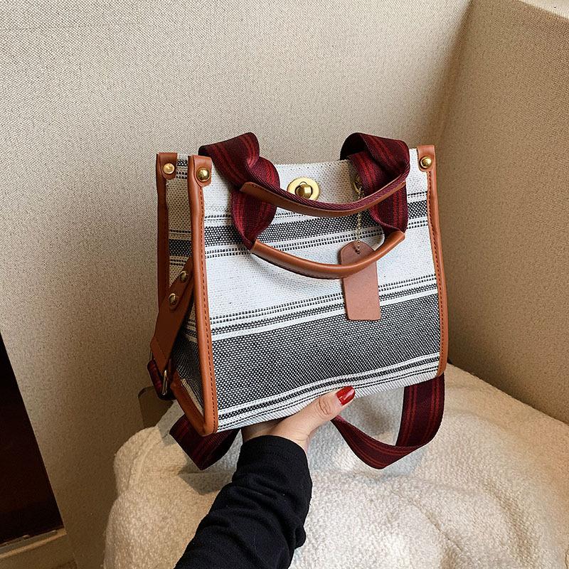 

New fashionable contrasting color striped size portable shoulder diagonal span trendy women s bag