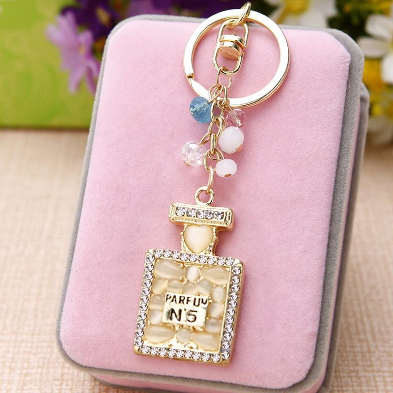 Portachiavi con pendente per borsa da donna con fibbia per chiave per auto con bottiglia di profumo con diamante adorabile
