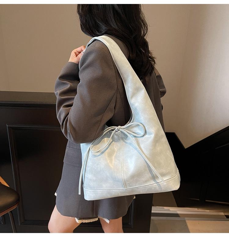 Koreanische, stylische Handtasche mit großem Fassungsvermögen und Schleifenverschluss – trendiges Design für Damen