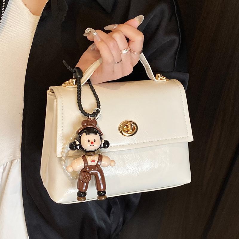 French simple high-end temperament oil wax leather portable small square bag women's commuting versatile solid color casual style messenger bag