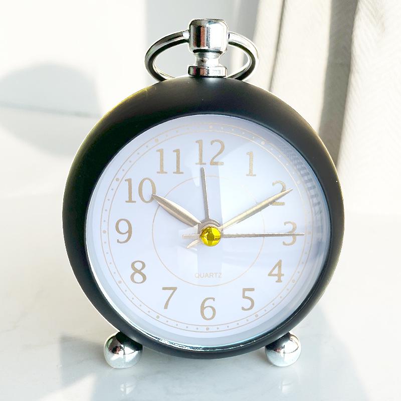 Silent Metal Alarm Clock with Night Light and Gold Stamped Spherical Face - Perfect for Students and Children.