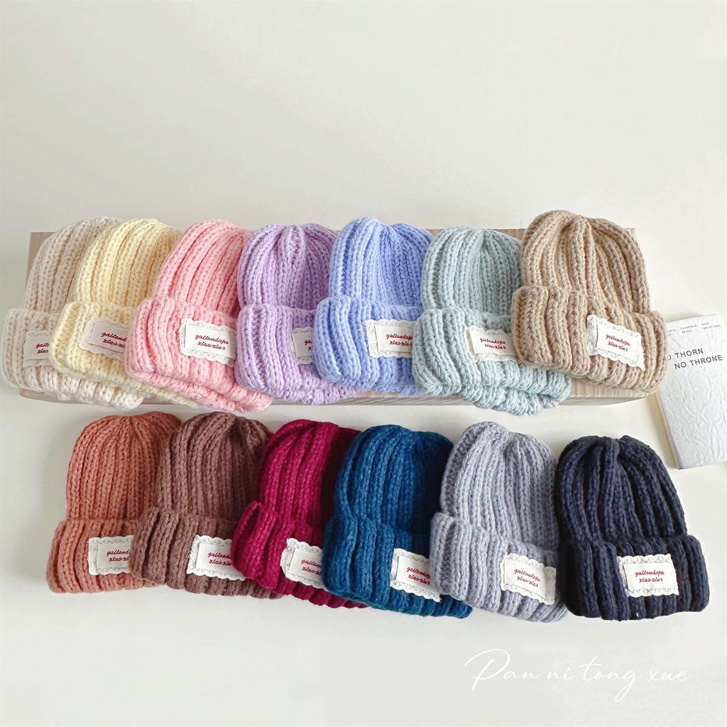 Neue Spitze Etikett Kinder Wollmütze Nuojiji Student Herbst und Winter Neu Warm und Vielseitig Ohrenschutz Strickmütze