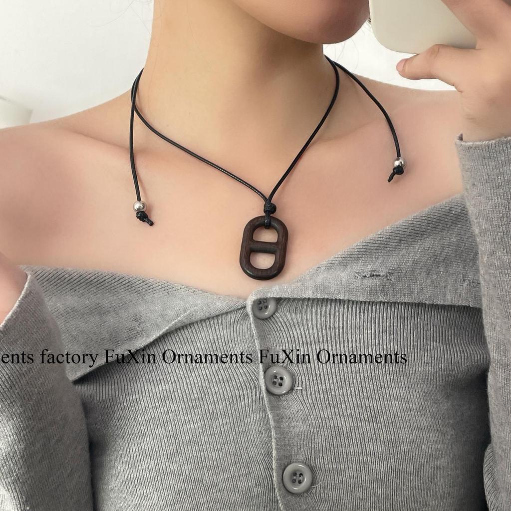Ebony Pig Nose Pendant Sweater Necklace – Elegant and Versatile Women's Accessory