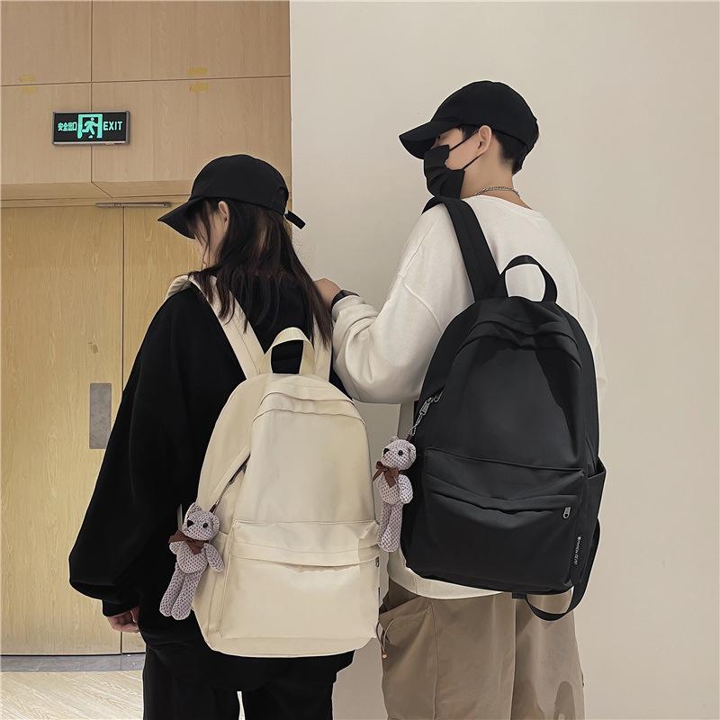 School bag female 2025 Korean version couple new large-capacity solid color versatile shoulder back trendy bag primary school students junior high sc