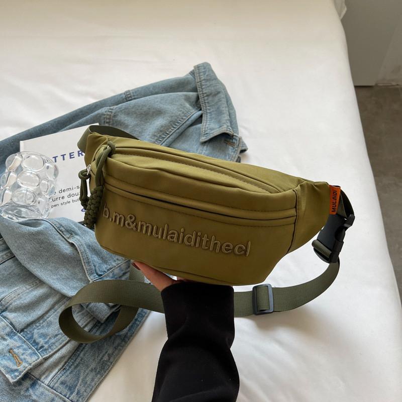 Versatile Water-resistant Canvas Crossbody Bag With Letter Print Perfect For Travel And Casual Use