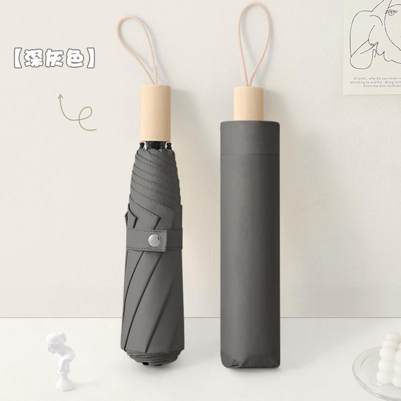 New three-fold simple plain color windproof and sun protection creative solid wood handle female vinyl parasol