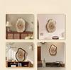 Clock with an irregular wood grain pattern; silent operation. Suitable as living room decor or as a tabletop clock (battery included).