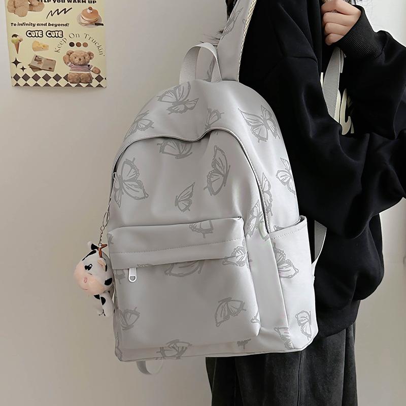 High-value reflective butterfly backpack, new junior high school girl high school student schoolbag ins niche travel backpack