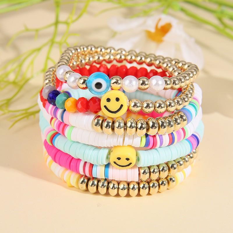 Korean version of fashion new multi-layer elastic thread soft pottery love smiley face bracelet set retro handmade pearl jewelry women