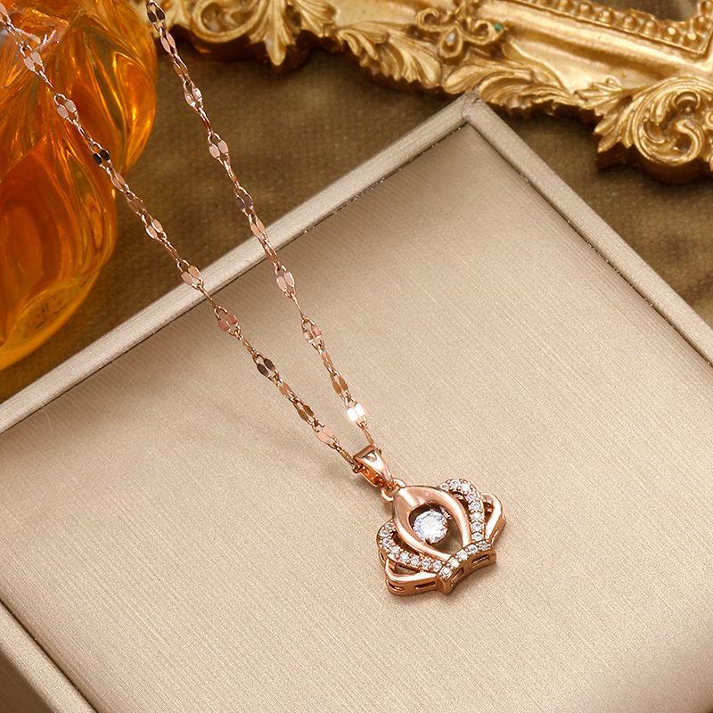 Lively Crown Titanium Necklace: Elegant Zirconia Pendant for Women's Distinctive Style.