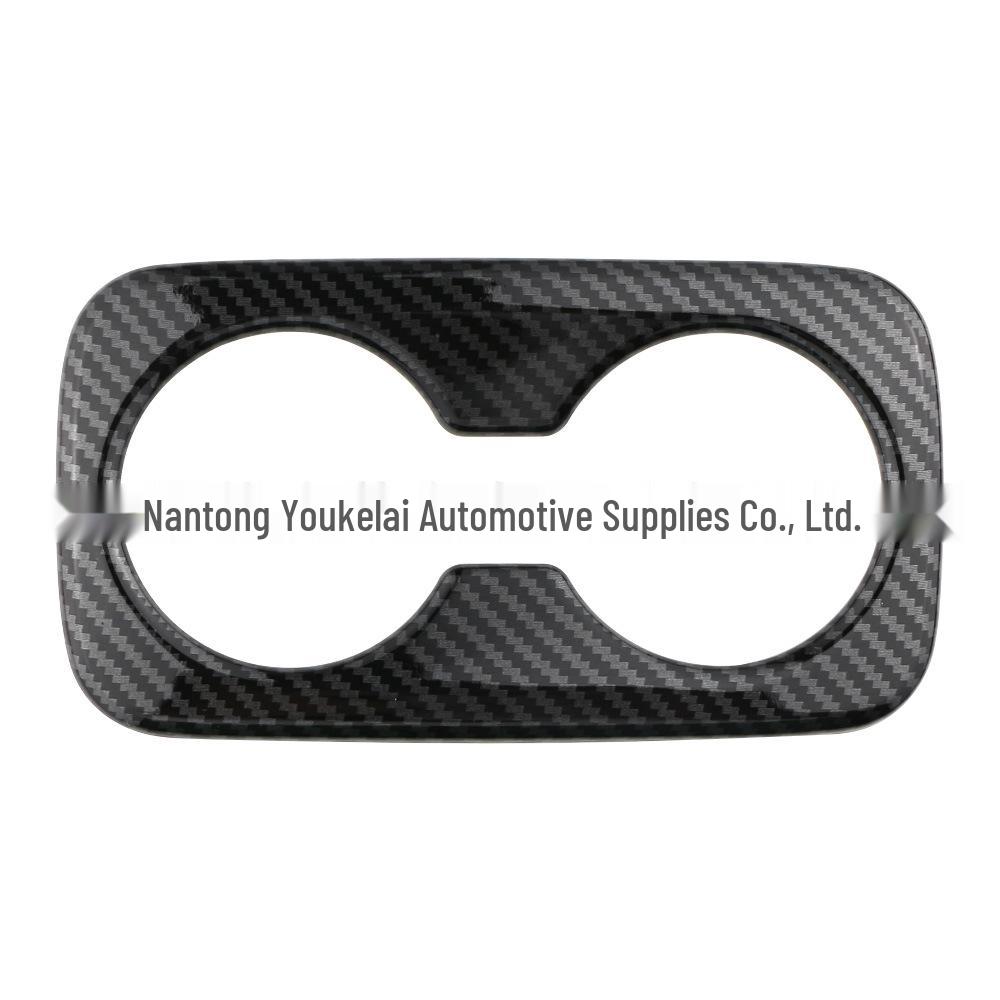 

Kia 22 Sportage Отделка рамки подстаканника заднего сиденья, карбоновое волокно