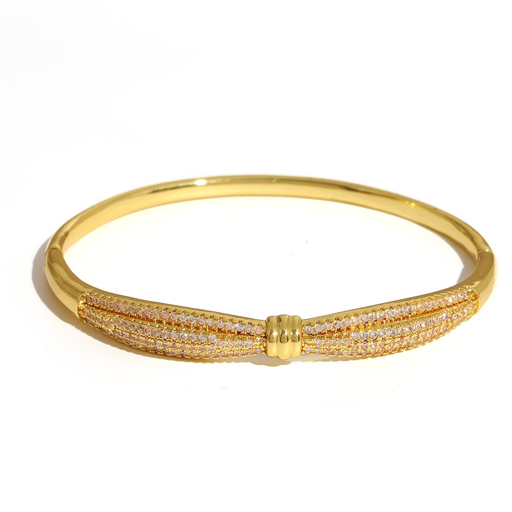 Luxuriöses funkelndes Strass-Armband, goldplattiert, für Damen, exquisites unregelmäßiges geometrisches Schleifenmanschetten-Federarmband Schmuck