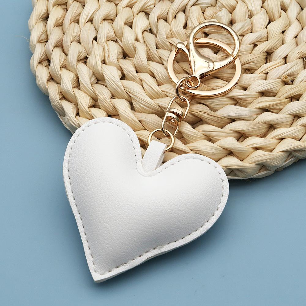 Spot wholesale PU simple peach heart bag pendant Xiaohongshu explosive love couple pendant keychain bag lanyard