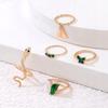 Set mit 5 goldenen Ringen im Retro-Punk-Vintage-Stil mit Schlangen- und Schmetterlingsmotiven (grün)