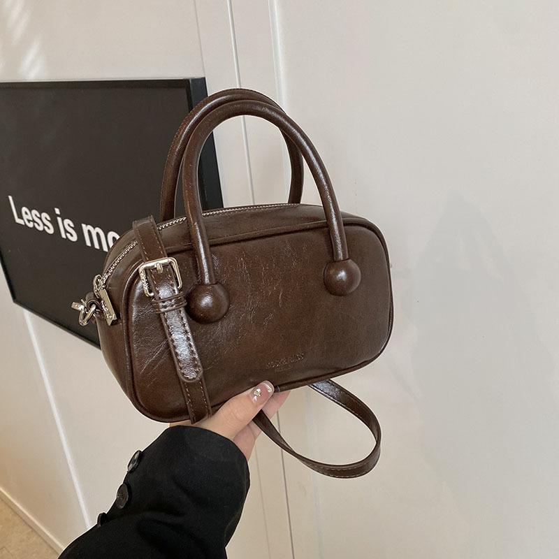 Hand-held bowling bag 2025 new fashion simple shoulder bag high-end niche women's bag