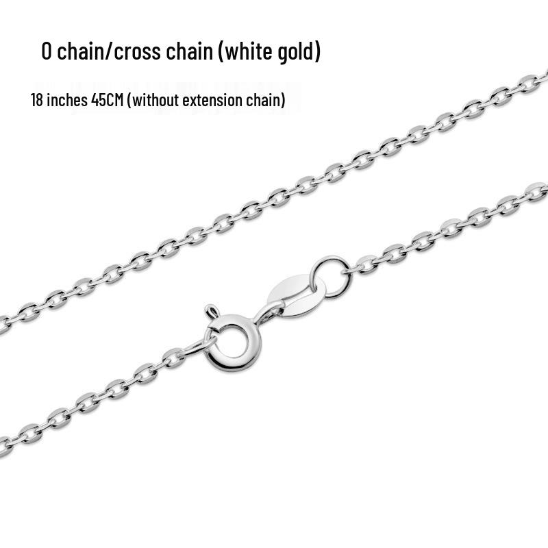 

Элегантный набор: кольцо с открытой шинкой с гранатом рубинового цвета и имитацией бриллиантов и подвеска из 18-каратного белого золота