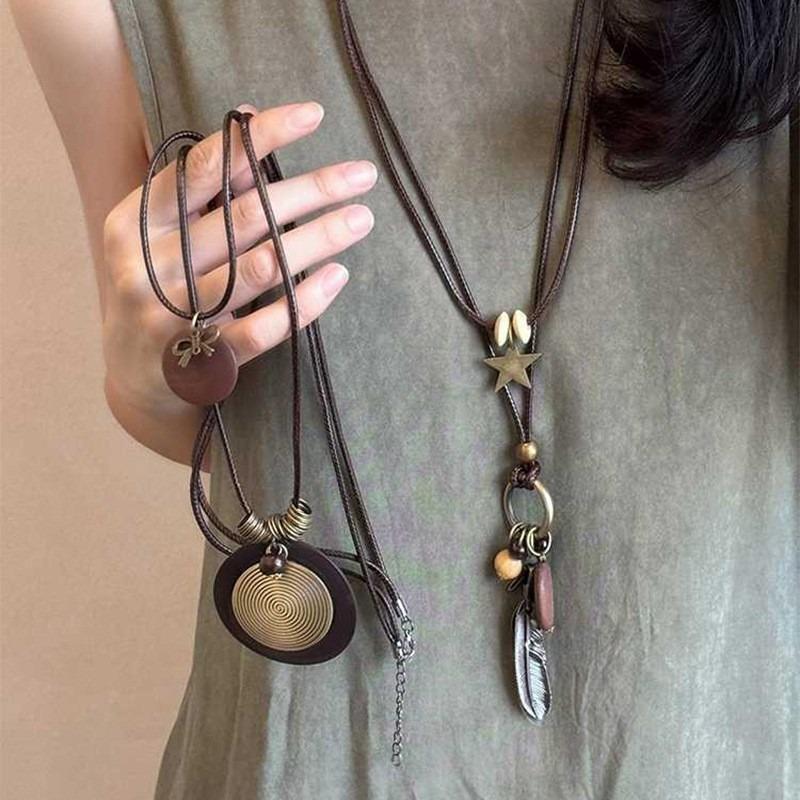 New Chinese leather pendant, fringed necklace, female ethnic style, niche retro sweater chain, fashion and high-end item jewelry.