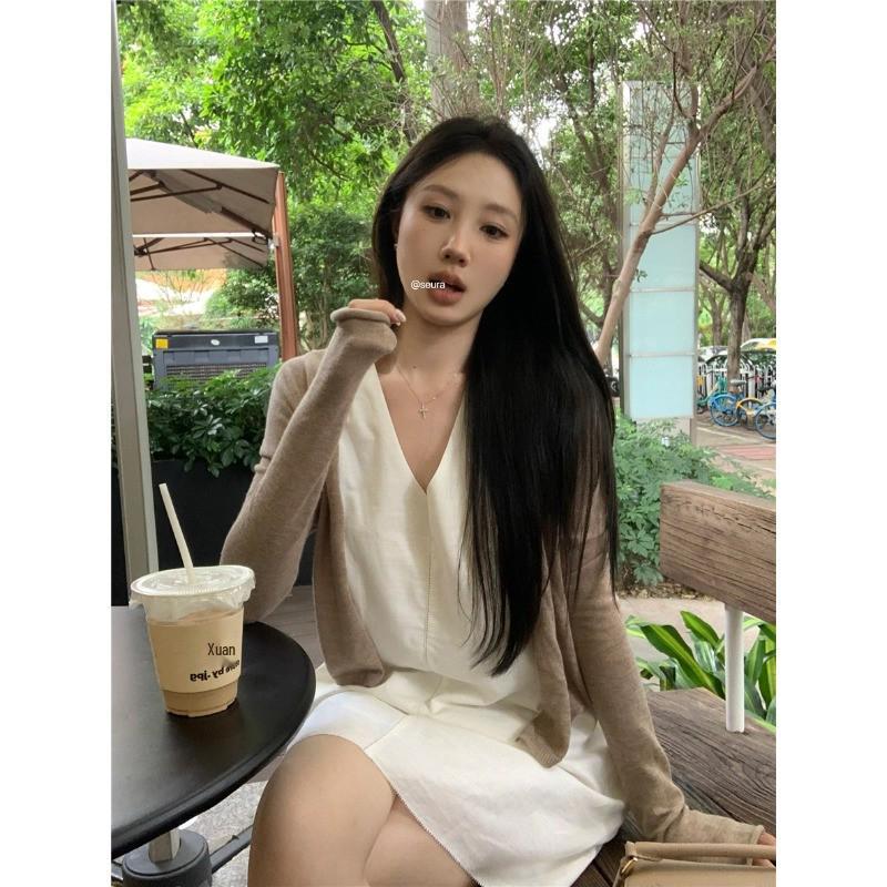 Women's Stylish V-Neck Sleeveless Summer Dress: Loose Fit, Slimming, Solid Color, Short Skirt - New Fashion Collection.
