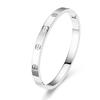 18K Gold Diamond-Inlaid Titanium Steel Bracelet, Women's Niche Luxury Design, Stainless Steel Hollow Letter Style.