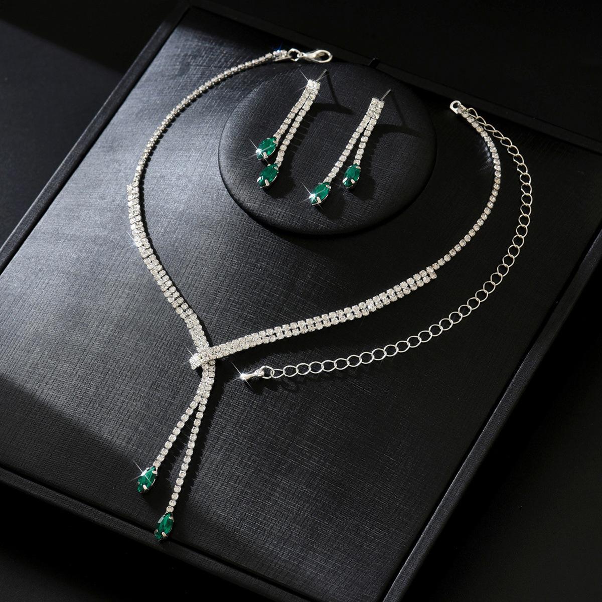 

Новые ювелирные изделия Длинное ожерелье с бриллиантами Серьги Ювелирные изделия Двухкомпонентное свадебное платье Ювелирные изделия