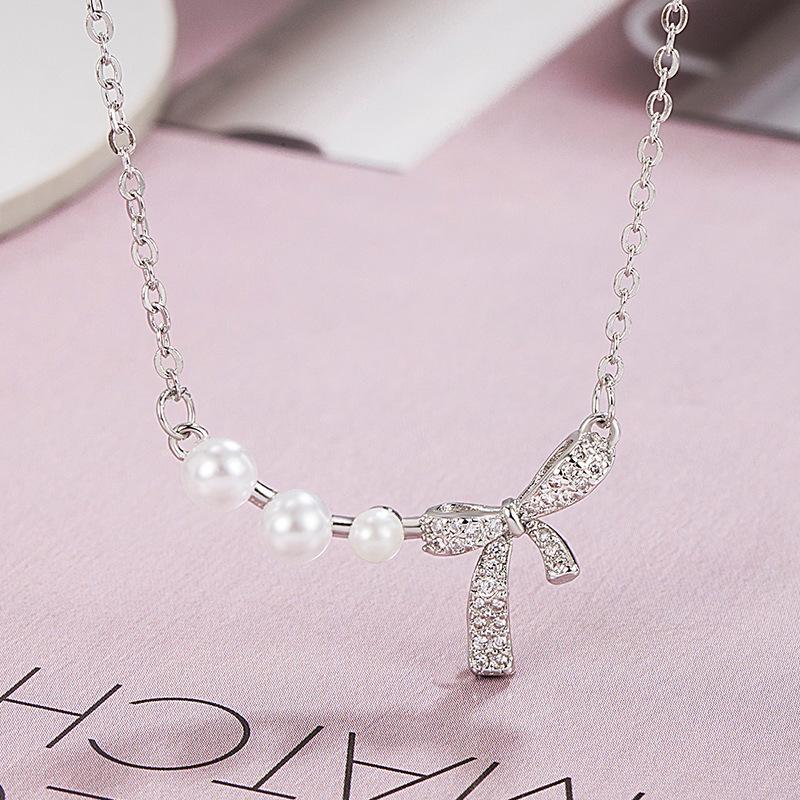 

Женское ожерелье с подвеской в виде бантика из хрустальных жемчужин one size